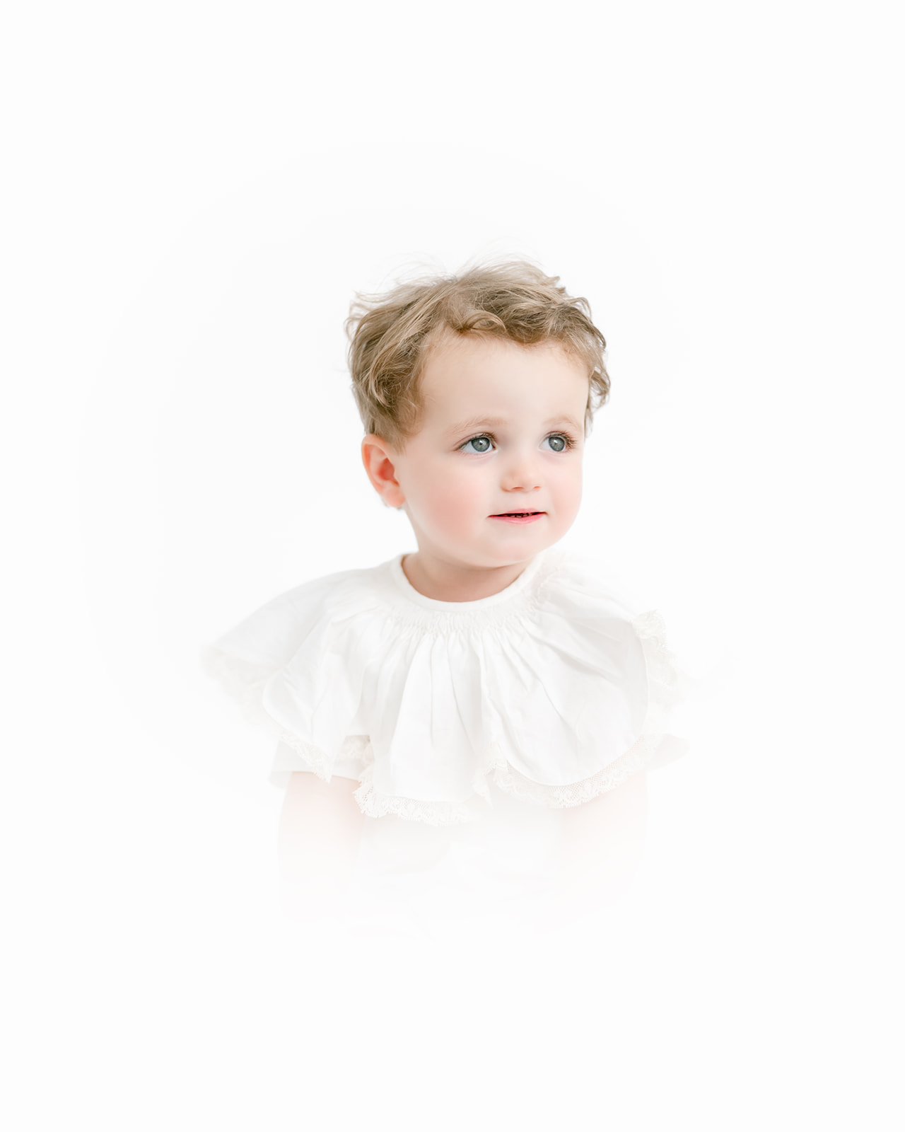 Young boy poses for heirloom session with Morgan Leigh Photography.