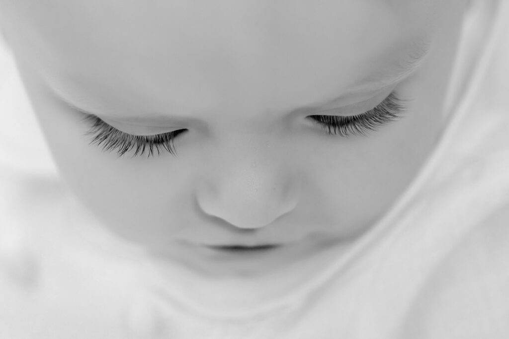 Black and white up close photo of baby's eyes.